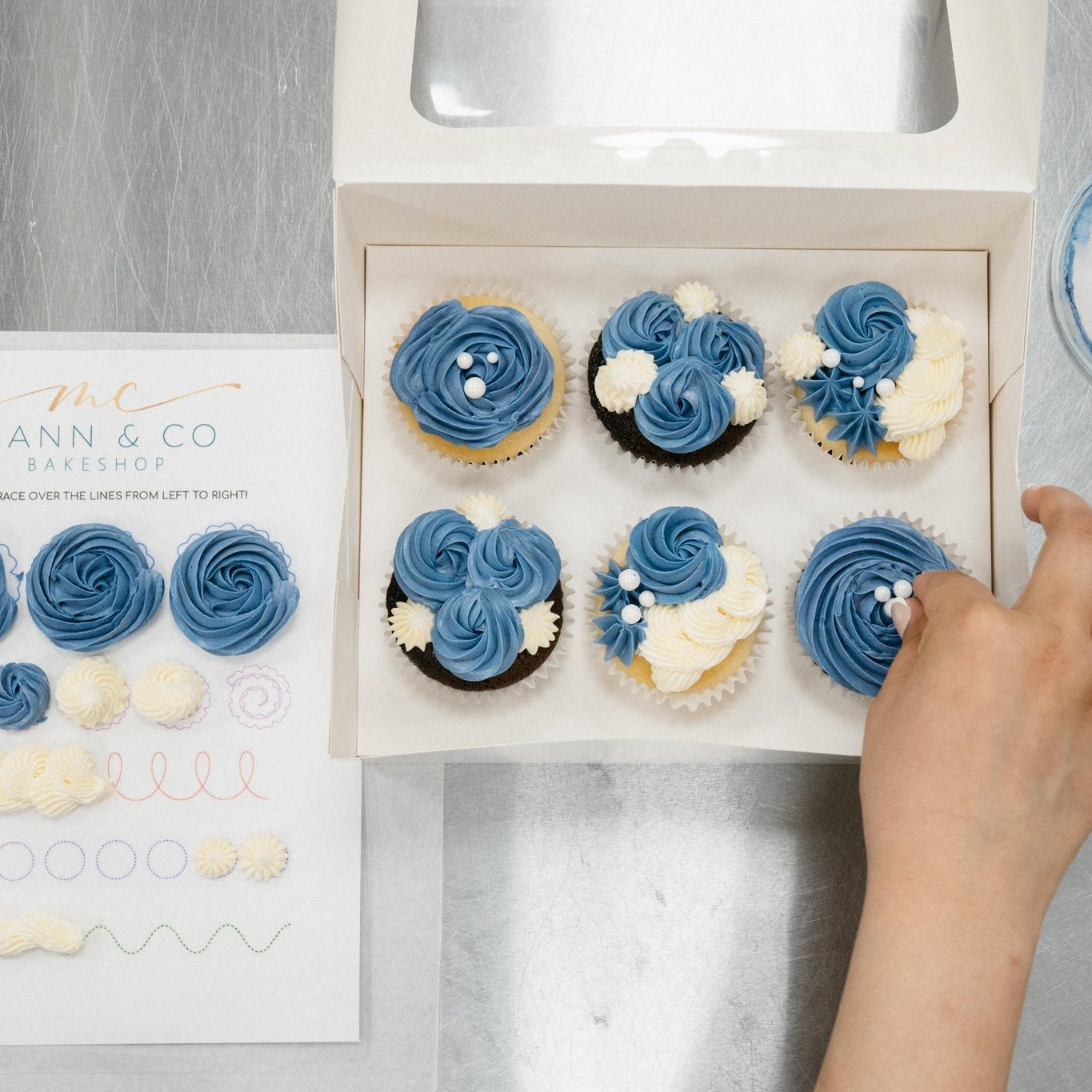 Cupcake Decorating with Jujhar Netflix Champion An overhead view of the finished cupcakes decorated by a guest in this Surrey Signature Experience